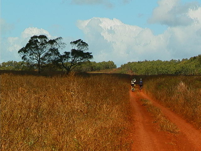 1.21bikers_on_red_grassy_rd.jpg